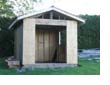 Picture of a wooden garden shed under construction.