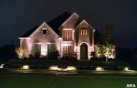 We used decorative outdoor lighting to add curb appeal to this house.