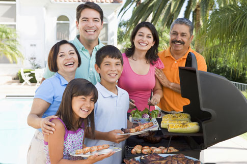 Family enjoying a barbecue on their new deck