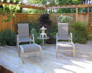 Picture of deck chairs with a nice asian garden in the background.